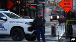 A state trooper stands by New Orleans' Canal and Bourbon streets, Jan. 2, 2025.