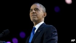 President Barack Obama pauses as he speaks at the election night party at McCormick Place in Chicago, early Wednesday, Nov. 7, 2012.