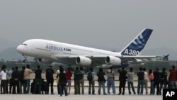 FILE - An Airbus A380 lands at the Guangzhou Baiyun International airport in Guangzhou, in China's southern Guangdong province.