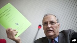 Efraim Zuroff, Chief Nazi hunter of the Simon Wiesenthal Center and director of the Center's Jerusalem Office, gestures during a news conference in Berlin, Germany, December 14, 2011.