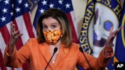 Speaker of the House Nancy Pelosi, D-Calif., meets with reporters at the Capitol in Washington, Oct. 8, 2020.