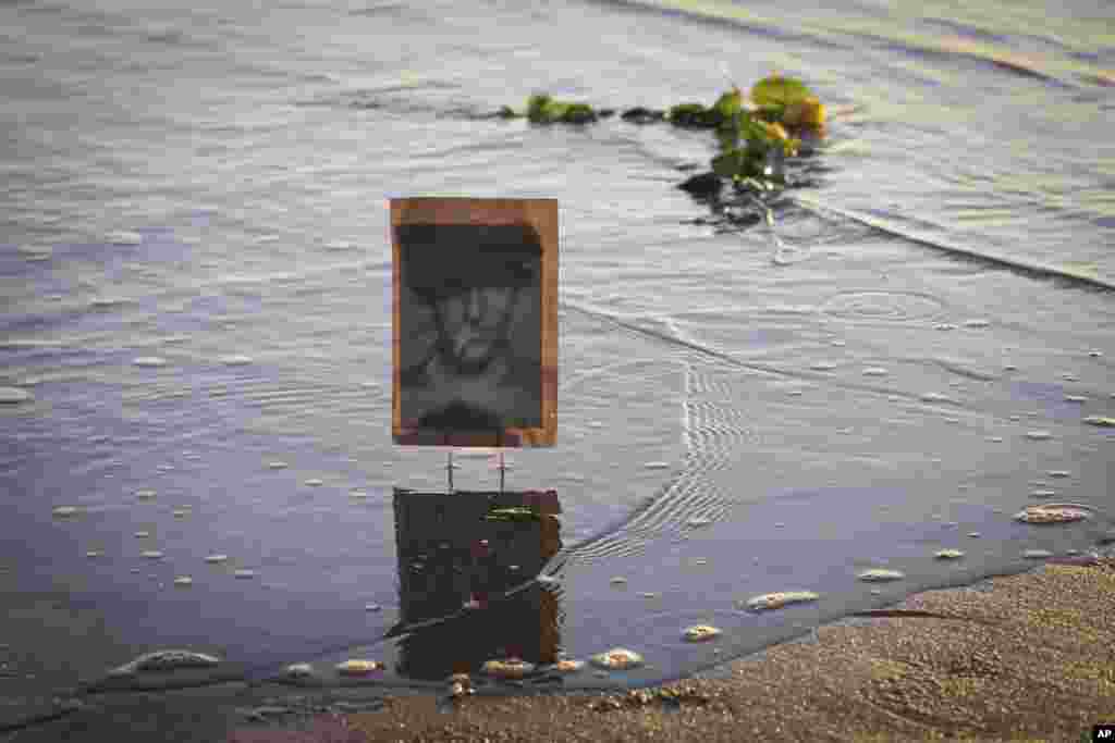 A picture of an unknown soldier is seen on the shore of Omaha Beach in Saint Laurent sur mer, Normandy, France, on the eve of 77th anniversary of the assault that helped bring an end to World War II.