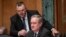 FILE - Senate Banking Committee Chairman Mike Crapo, R-Idaho, center, joined at left by Sen. Jon Tester, D-Mont., listens during a hearing on U.S. economic sanctions against Russia and whether the actions are effective, on Capitol Hill, Aug. 21, 2018. 