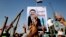 Supporters of Egypt's Islamist President Mohammed Morsi flash victory signs during a rally, Nasser City, Cairo, July 3, 2013.