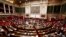 FILE - A general views shows the hemicycle as French Prime Minister Manuel Valls delivers a speech during a parliamentary debate on Iraq at the National Assembly in Paris, Sept. 24, 2014. 