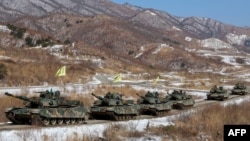 South Korean K1A2 tanks move during a joint live-fire drill between South Korea and the United States at the Seungjin Fire Training Field in Pocheon on March 6, 2025. 