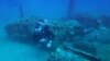 A diver explores the wreckage of an American bombardier fighter plane from the Second World War, the Lockheed P-38G Lightning, at 38 meters of depth, on August 12, 2018, off the coast of La Ciotat, southern France.
