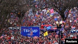 Supporters of U.S. President Donald Trump gather near the Washington Monument by the White House ahead of his rally and speech to contest the certification by the U.S. Congress of the results of the 2020 U.S. presidential election in Washington.