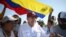 FILE - Venezuelan opposition presidential candidate Edmundo Gonzalez Urrutia greets supporters upon his arrival at the campaign act in Barlovento Town in Miranda State, Venezuela, on June 26, 2024.