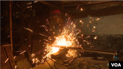 Once electricity comes on around 10 p.m., businesses that need electricity to function spring to life, even on cold, blustery winter nights, in Harare, July 9, 2019. (Columbus Mavhunga/VOA)