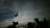 FILE PHOTO: A Chinook helicopter lands to pick up U.S. soldiers of the 101st Airborne Division following a night raid in Yahya Khel, Paktika province, Afghanistan, Feb. 21, 2011.