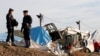 Workers Demolish Calais 'Jungle' Refugee Camp