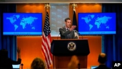 FILE - State Department spokesman Ned Price takes questions from reporters at the State Department in Washington, March 31, 2021.