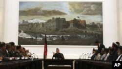 Afghanistan's President Hamid Karzai speaks during a meeting with the family members of civilians killed by U.S. soldier in Kandahar last week at the presidential palace in Kabul, March 16, 2012. 