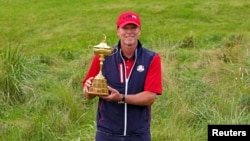 Team USA captain Steve Stricker poses with Ryder Cup after the United State beat Europe for the 43rd Ryder Cup golf competition at Whistling Straits, Sep 26, 2021.