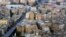 FILE - This July 18, 2014, photo shows buildings, to the right of the bridge, that are to be demolished as part of a redevelopment plan in the Maspero neighborhood of Cairo, Egypt. Egyptian authorities are demolishing the 19th-century neighborhood to make way for high-end housing and business development.