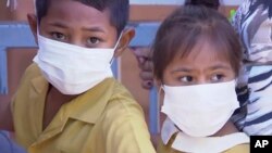 Children wait to be vaccinated at a health clinic in Apia, Samoa, in November. Samoa closed schools, Nov.18, 2019, banned children from public gatherings and mandated vaccinations for everyone after declaring an emergency because of a measles outbreak.