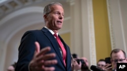 FILE - Senate Majority Leader John Thune speaks to reporters at the Capitol in Washington, Feb. 19, 2025.