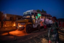 People who fled the conflict in Ethiopia's Tigray region arrive on a bus at Umm Rakouba refugee camp in Qadarif, Sudan, Nov. 26, 2020. The Ethiopian army announced Nov. 28 that it had taken full control of Mekelle, Tigray's capital.