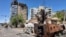 Members of army walk near bombed buildings, as Sudan's army retakes ground in the state of Khartoum, Sudan.
