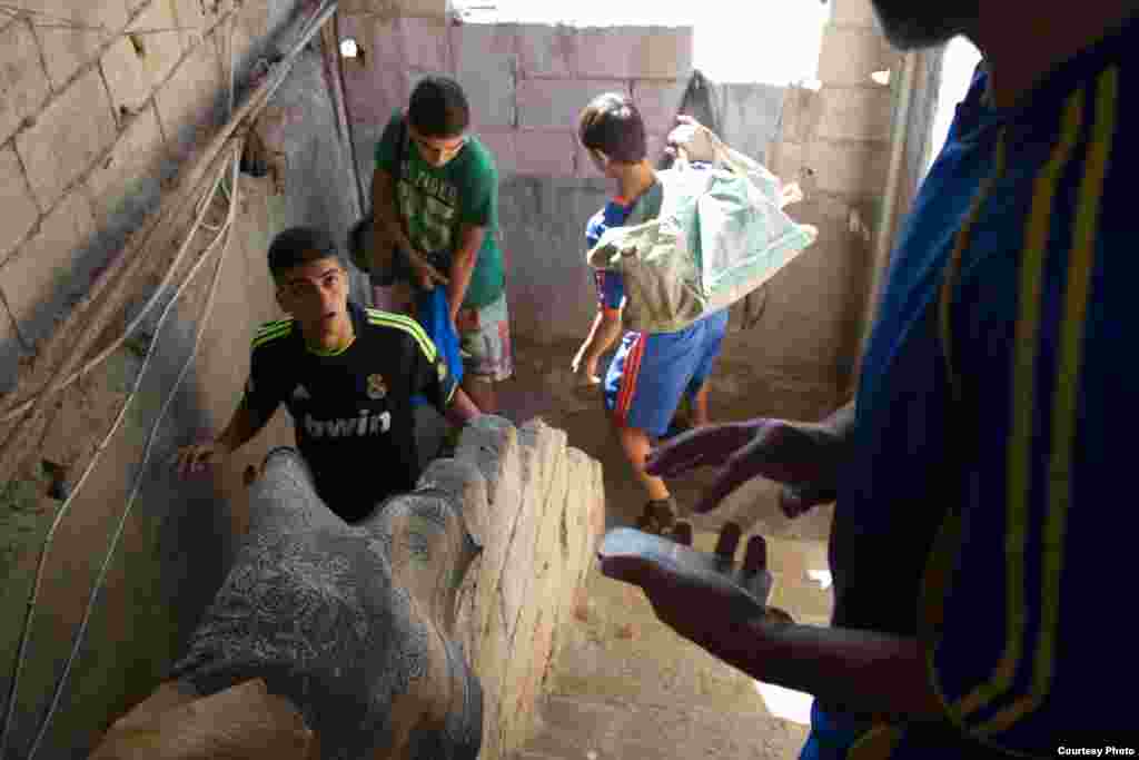 Players leave Majdi Adam&rsquo;s home. The football teams train weekly and play games against other local teams, Lebanon, Dec. 2, 2014. (John Owens/VOA)