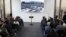 Invitees wait for the start of the inauguration ceremony of a floor made with melted weapons in Bogota, Colombia, July 31, 2018. 