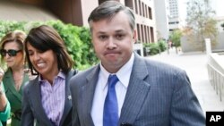 FILE - John Beliveau Jr. is accompanied by attorney Gretchen von Helms, left, at the federal courthouse in San Diego, California, Dec. 17, 2013. Beliveau was sentenced to 12 years in prison on Friday for his role in corruption against the U.S. Navy.