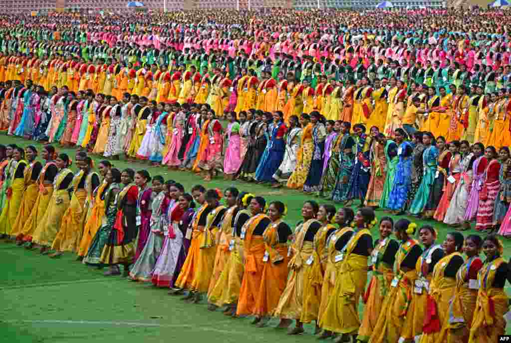 Thousands of dancers perform &quot;jhumur,&quot; an Indian folk dance, as they rehearse for the upcoming Jhumur Festival at the Sarusajai Stadium in Guwahati, India.