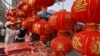 People shop for decorations at a market in Fuyang, in China’s eastern Anhui Province, Jan. 22, 2025, in the buildup to celebrations of the Lunar New Year. Many Chinese are cutting back on Spring Festival expenses because of the stressed economy.