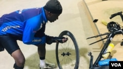 Meli Ndlovu fixing his bicycle on Sunday evening in Gwanda, 126 kilometers from Bulawayo. (Photo: Albert Ncube)