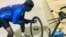 Meli Ndlovu fixing his bicycle on Sunday evening in Gwanda, 126 kilometers from Bulawayo. (Photo: Albert Ncube)