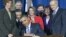 FILE - Lawmakers and supporters look on as President Barack Obama signs legislation to repeal the "Don't Ask, Don't Tell" policy and allow gays to serve openly in the military in Washington, Dec. 22, 2010.