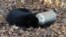 In this photo provided by the Maryland Department of Natural Resources' Wildlife and Heritage Service, a male black bear rests with its head stuck in a milk can near Thurmont, Md., Nov. 16, 2015.