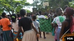 A group of young girls in Malawi at a basketball court in Blantyre. (Lameck Masina for VOA News)