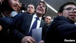 Sacked Catalan leader Carles Puigdemont departs after a news conference at the Press Club Brussels Europe in Brussels, Belgium, Oct. 31, 2017.