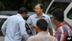 Satyam Computer Services founder B. Ramalinga Raju, center, arrives at a court in Hyderabad, India, Monday, March 9, 2015.