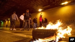 Supporters of Prime Minister-designate Saad Hariri block a road link to the international airport in Beirut, Lebanon, March 22, 2021.