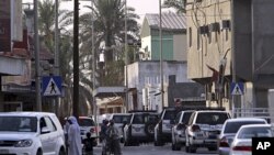 Riot police vehicles move through the streets of the western Shiite Muslim village of Malkiya, Bahrain, June 1, 2011