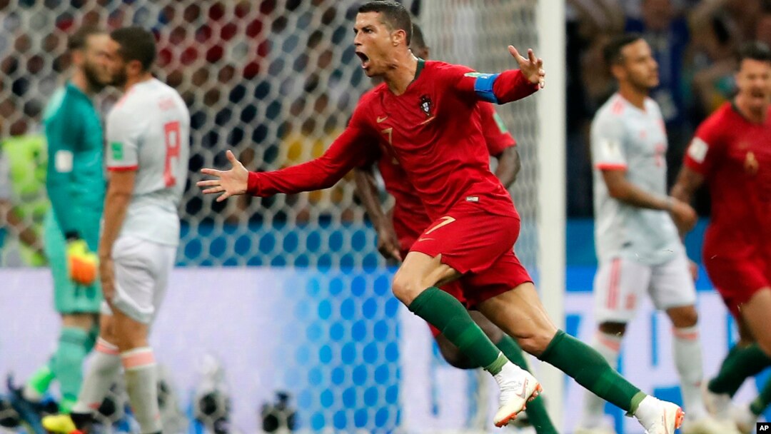 Portugal's Cristiano Ronaldo celebrates after he scored his third goal with a free kick during a group B draw, 3-3, with Spain at the 2018 World Cup in the Fisht Stadium in Sochi, Russia, June 15, 2018. 