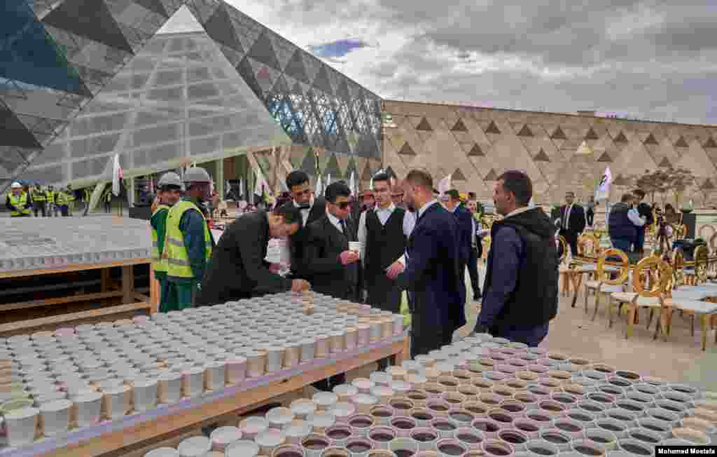 For &quot;Guinness&quot; to record the event, the coffee cups have to be distributed to people to drink. (H. Elrasam/VOA)