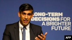 FILE - Britain's Prime Minister Rishi Sunak delivers a speech on Artificial Intelligence in London on October 26, 2023. He said that the government must be "honest" about the risks posed by AI.