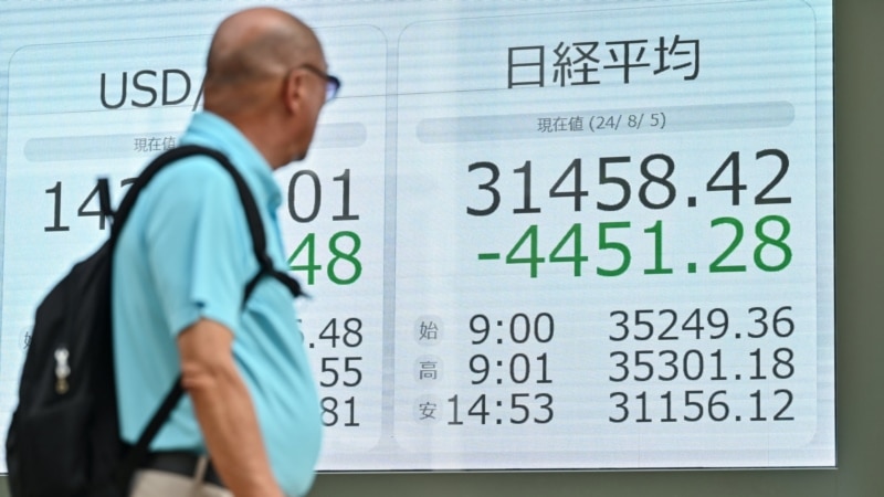 Japan stocks plunge, leading global market sell-off
