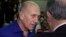 Israel's former Prime Minister Ehud Olmert speaks to a lawyer upon his arrival at the Tel Aviv District Court in Israel, Tuesday, May 13, 2014. Olmert was sentenced on Tuesday to six years in prison for his role in wide-ranging bribery case, capping a stu