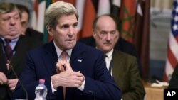 U.S. Secretary of State John Kerry takes part in an international conference on Libya, at the Ministry of Foreign Affairs in Rome, Dec. 13, 2015.