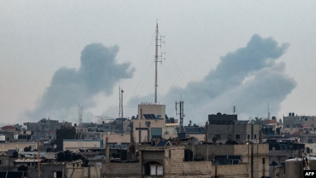 This picture taken from Rafah shows smoke billowing over Khan Yunis in the southern Gaza Strip during Israeli bombardment on Feb.y 20, 2024, amid continuing battles between Israel and the Palestinian militant group Hamas.