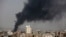 FILE - Smoke rises after Saudi-led coalition airstrikes in Sana'a, Yemen, Aug. 9, 2016. The coalition is now hoping to gain control of a number of Red Sea ports, key among them the port of Hodeida.