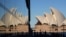 People walk around the waterfront of at Campbell Cove in Sydney, Australia, May 19, 2021. 