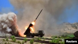 FILE - A view of a multiple rocket launcher during an exercise in this undated photo released by North Korea's Korean Central News Agency (KCNA) in Pyongyang.