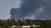 (FILES) Smoke billows over buildings in Khartoum on May 1, 2023 as deadly clashes between rival generals' forces have entered their third week.