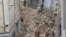 Firefighters work at the scene where buildings collapsed in Marseille, southern France, Nov. 5, 2018. 